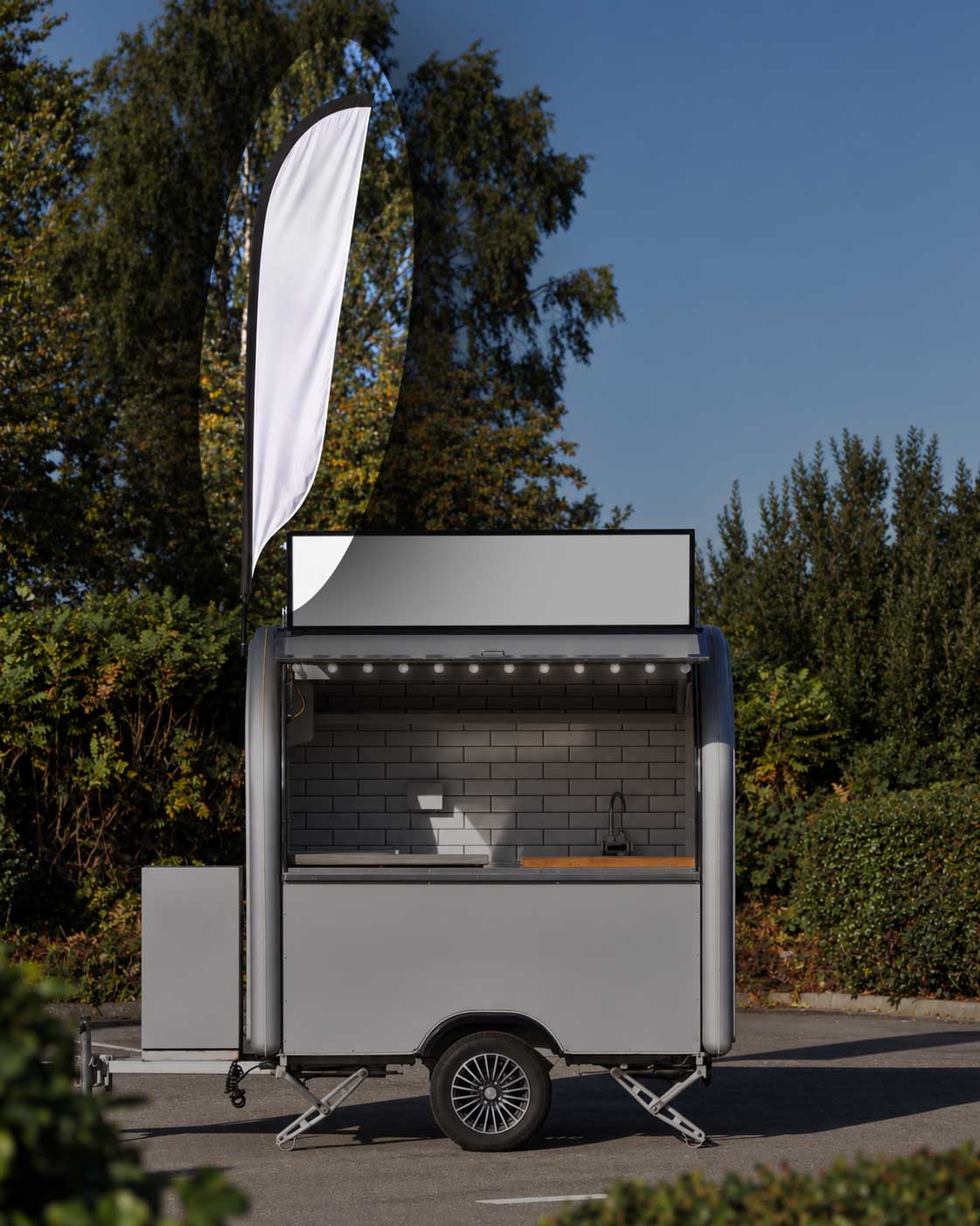 Mr Hot Dog food truck with a branded quill flag