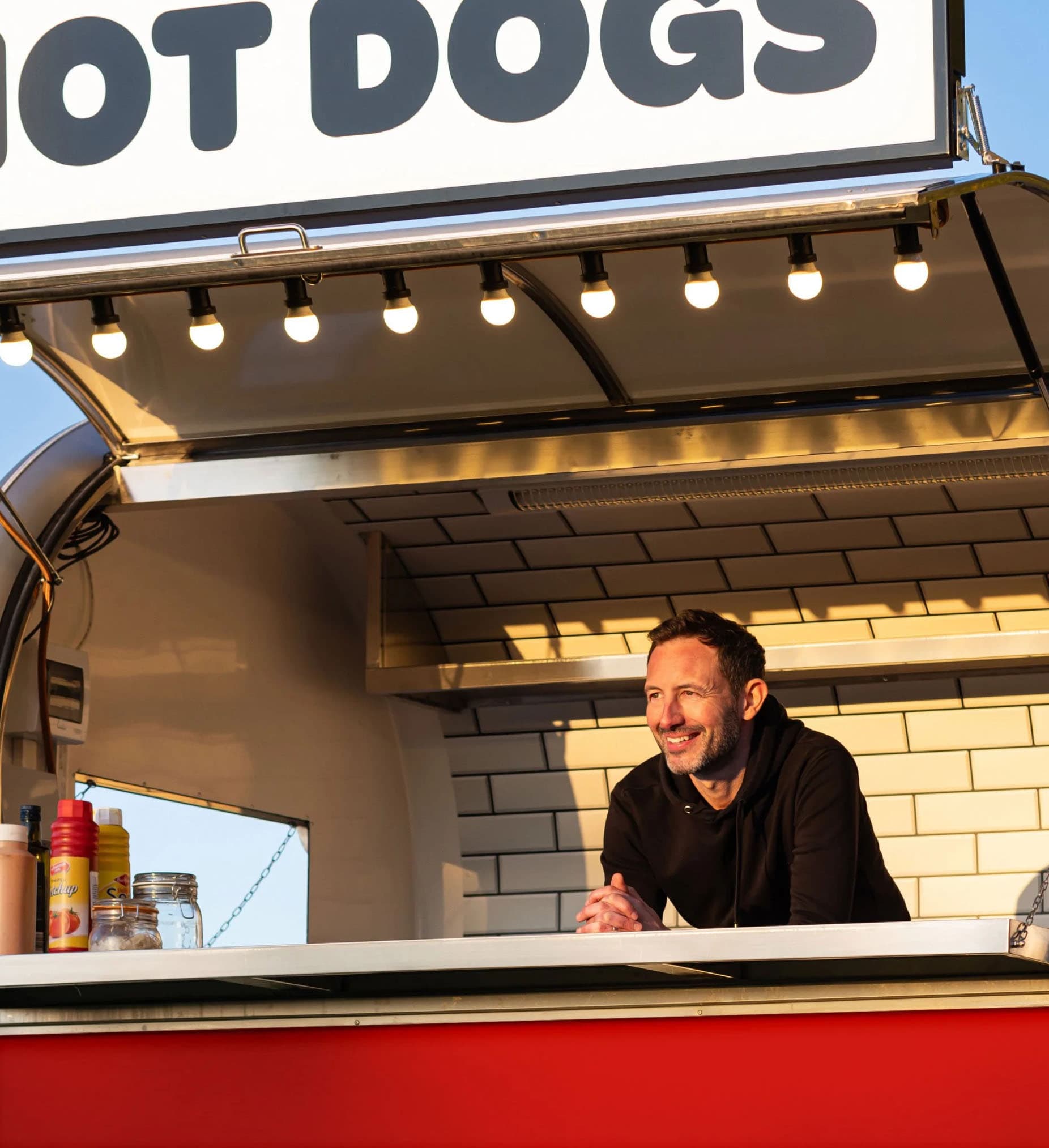 David, owner of Mr Hot Dog, ready to serve at a corporate event